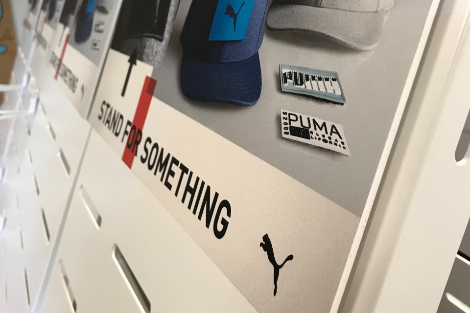 Cobra Puma Golf caps and belts displays